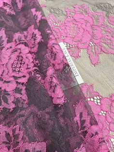 pink and black lace with flowers on it