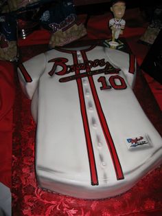 a cake that is shaped like a baseball jersey