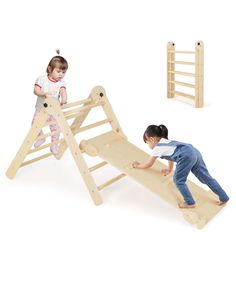 two children playing on a wooden play set