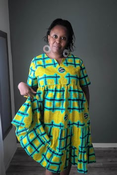 This roomy African print cotton summer dress will be one of your favorites this summer.  Fit: Relaxed Details:  - Dropped armholes - one button back closure - In seam side pockets Garments Measurements: MEDIUM Bust: 46 in Waist:  46 in Hips:  FREE Sleeve Length: 9 in Full Length: 42 in LARGE Bust: 48 in Waist:  48 in Hips:  FREE Sleeve Length: 9 in Full Length: 42 in READY TO SHIP IN 5 DAYS Machine Washable (cold with like colors suggested) and Dryer Safe  Hand wash is better to preserve the bri Cotton Short Sleeve Sundress, Yellow Cotton Midi Dress With Short Sleeves, Multicolor Cotton Sundress With Short Sleeves, Yellow Cotton Knee-length Sundress, Yellow Cotton Sundress With Short Sleeves, Yellow Cotton V-neck Sundress, African Print Dress Ankara, African Dresses Modern, African Print Dress Designs