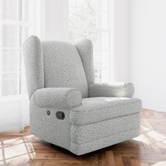 the recliner chair is in front of a window