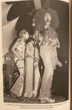 an old black and white photo of two women on stage with microphones in front of them