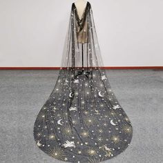 a veil with stars and moon designs is on display at the museum's exhibition