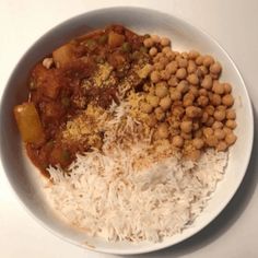 a white plate topped with rice and beans