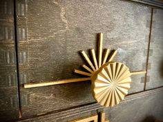 a close up of a wooden cabinet with a clock on it