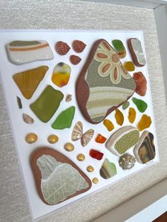 Rise and shine with this fun and groovy color scheme! Handcrafted framed collage made with authentic sea glass, sea pottery, and other sea treasures I've collected from beachcombers and mudlarkers around the globe.  Overall measurements: 9x9 inch Outer mat measurement: 8x8 inch Inner mat measurement: 5.5x5.5 inch You may customize the color of the frame and mat using the selections in this listing. Frames are covered with glass to protect from dust and other elements. Hang on a wall, place in a picture frame stand, or set the frame straight up on a flat surface. Authentic sea glass and pottery are items that find their way into the ocean and magnificently transform over decades by the waves and sand into beautiful treasures with softened edges and a frosty finish. I adore the beauty and hi Groovy Collage, Seashell Collage, Framed Collage, Picture Frames Standing, Sea Pottery, Collage Making, Rise And Shine, Sea Glass Art, Night Art