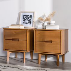 two wooden nightstands sitting next to each other on top of a carpeted floor