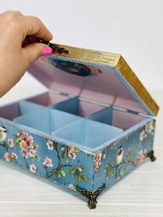 "Blue box Chinoiserie Birds for storing . A beautiful and unique gift for storing anything - tea, trinkets or jewelry. The wooden box, decorated with decoupage, was sealed and covered with durable glossy varnish. Wooden box, decorated on all sides. The box has beautiful antique legs and a handle on the lid. The box has removable dividers. This is handy if you want to store something more in this box. The perfect gift or decorative item for your home. 3 compartment box dimensions - 21*9.5*7.5 cm   for 4 compartments - 16.5*16.5*7.5 cm    for 6 compartments - 21.5*16*7.5cm (8.5*6.4*3\")  for 8 compartments - 16*29*7.5 cm (6.2*11.5*3\")   for 9 compartments - 25 * 25 * 7.5 cm (10*10*3\")  for 12 compartments - 25*29*8 cm (10*11*3\")   Easy care - if necessary, wipe with a dry or damp cloth. D Tea Boxes, Tea Box Storage, Box Hat, Box Kitchen, Blue Tea, Tea Box, Studio Ideas, Box Storage, Blue Box