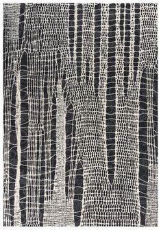 a black and white rug with trees on it