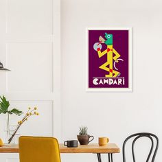 a table and chairs in a room with a poster on the wall above it that says zamadi