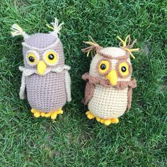 two crocheted owls sitting in the grass