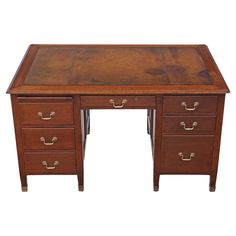 an old wooden desk with three drawers