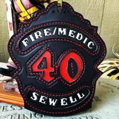 a sign that says fire / medic 40 sewellu on the front and back