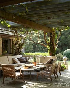 an image of a patio with furniture and trees in the background, taken on instagram