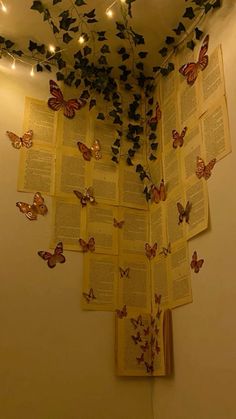 the butterflies are flying over the open book on the wall above the bookshelf