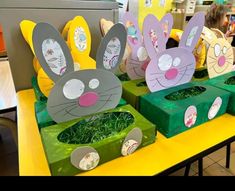 easter decorations made to look like bunnies with faces on them and grass in the middle