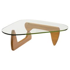 a glass and wood coffee table with an arrow shaped base on the bottom, in front of a white background