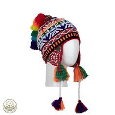 Immerse yourself in the vibrant spirit of the Andes with our meticulously crafted Beaded Shaman Ch'ullo. This unique winter hat is adorned with lively pom poms, playful tassels, and intricate beadwork, a true testament to the skill of indigenous artisans in Pisac, Cusco - PERU. The Ch'ullo is expertly woven with a rich palette of multicolored wool threads and features ear flaps for added warmth. Its captivating design proudly showcases the symbolic "Andean Llama," deeply rooted in the cultural h Adjustable Multicolor Costume Hats And Headpieces For Winter, Traditional Adjustable Beanie Hat, Multicolor Costume Beanie, Adjustable Multicolor Costume Cap, Multicolor One Size Beanie Costume Hats, Handmade Multicolor Cap Bonnet, Handmade Multicolor Bonnet Cap, Multicolor Bohemian Beanie Hat, Bohemian Adjustable Bonnet For Festivals