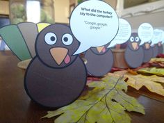 a table topped with lots of paper turkeys