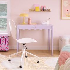 a room with a bed, desk and chair next to a window that has pink walls