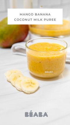 mango banana coconut milk puree in a glass bowl with sliced bananas on the side