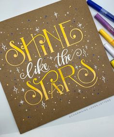 a card with the words shine like the stars on it and some crayons next to it