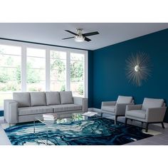 a living room with blue walls and white furniture in the center, along with a large rug on the floor