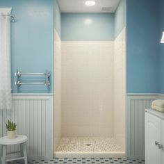 a bathroom with blue walls and white fixtures