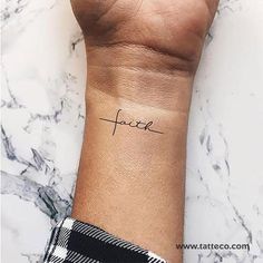 a wrist tattoo with the word peace on it