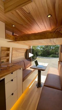 the inside of a camper with wood paneling