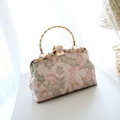 Add an original look to your outfit. These stunning purses are crafted with a focus on quality and detail. They’re especially suitable for weddings and special occasions. DESIGN – The fabrics are embossed with a floral design in pastel colours (Two styles). Enhanced with a gorgeous ornate clasp. FEATURES – Handle and chain shoulder strap. Size: 22 x 16 x 5 cm. MATERIAL – Polyester fabric, nylon liner. Feminine Beige Wedding Bags, Pink Floral Embroidered Clutch Bag, Elegant Spring Gift Clutch, Elegant Rectangular Spring Evening Bag, Elegant Rectangular Evening Bag For Spring, Feminine Cream Bags For Wedding, Elegant Pink Bag With Pearl Handle, Feminine Beige Rectangular Evening Bag, Feminine Cream Wedding Bags