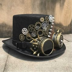 A Victorian-style hat with Steampunk elements like cogs and gears The goggles are included with the hat! Steampunk top hat for men and women Special use: costume or cosplay Material: wool, polyester  Circumference: 22.4" | 57cm Height : 5.1" | 13cm Looking for something similar? Embark on an adventure with our Steampun Cogs And Gears, Steampunk Elements, Moda Steampunk, Diy Steampunk, Steampunk Top, Steampunk Artwork, Mode Steampunk, Steampunk Couture, Steampunk Aesthetic