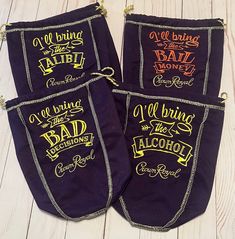 three pairs of aprons with sayings on them