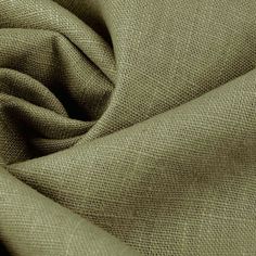 a close up view of the fabric on a plain cloth, with some light green colors