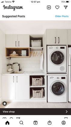 a white laundry room with washer and dryer next to each other on the wall