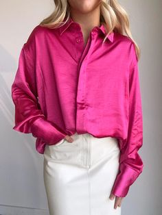 The softest washed satin in a hot pink button up featuring an oversized fit and extra length in the back. This polished button-up is crafted from washed satin with a drapey, relaxed fit that'll keep your look on point. 29 1/2" length (size 1/2) Spread collar Long sleeves with button cuffs 100% polyester Machine wash, line dry True to size Love Potion, Good American, Look On, Button Up Shirts, Hot Pink, That Look, Button Up, Style Inspiration, Relaxed Fit