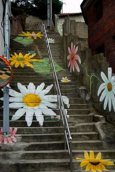 some flowers are painted on the steps outside