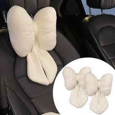 three white bows on the back of a car seat