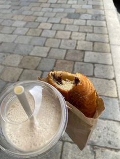 there is a pastry and drink on the table