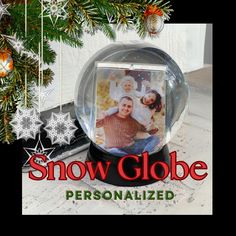 a snow globe with an image of two people in it and the words, snow globe personalized