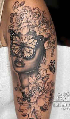 a woman's face with butterflies and flowers on her thigh, as if she was wearing a butterfly mask