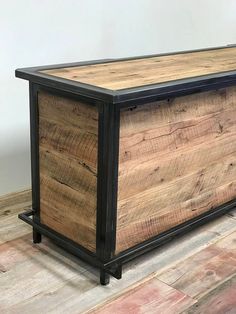 a large wooden box sitting on top of a hard wood floor