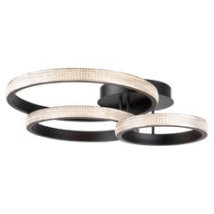 two black and white circular lights hanging from the ceiling, one light on each side