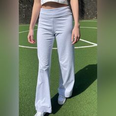 Soft Cotton Blend Yoga Pants With A Wide Pant Leg. Fabrics: 96% Cotton 4% Elastane Measurement: 12" (30 Cm) Rise, 31" (79 Cm) Inseam, 25" (63.5 Cm) Waist (Stretches) Made In: Italy Priscilla Pants, Brandy Melville Sweatpants, Fold Over Yoga Pants, Rosa Sweatpants, Brandy Melville Pants, Plaid Trousers, Waist Stretches, Blue Flannel, Green Cargo Pants