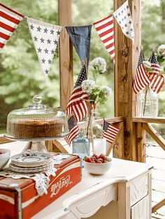 an american flag bunting and cake on a table