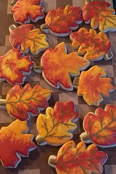 cookies decorated with leaves on a checkered tablecloth