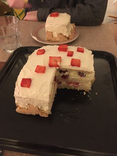 a cake that has been cut in half on a plate with one slice missing from it