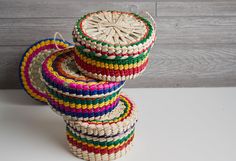 three woven baskets stacked on top of each other