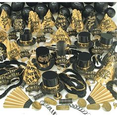 an assortment of black and gold party hats, decorations, and other items for a new year's eve celebration