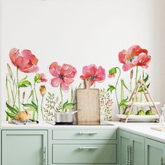 a kitchen wall with flowers painted on it